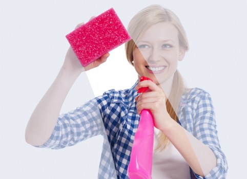 Vacuuming a mattress to remove dust and allergens